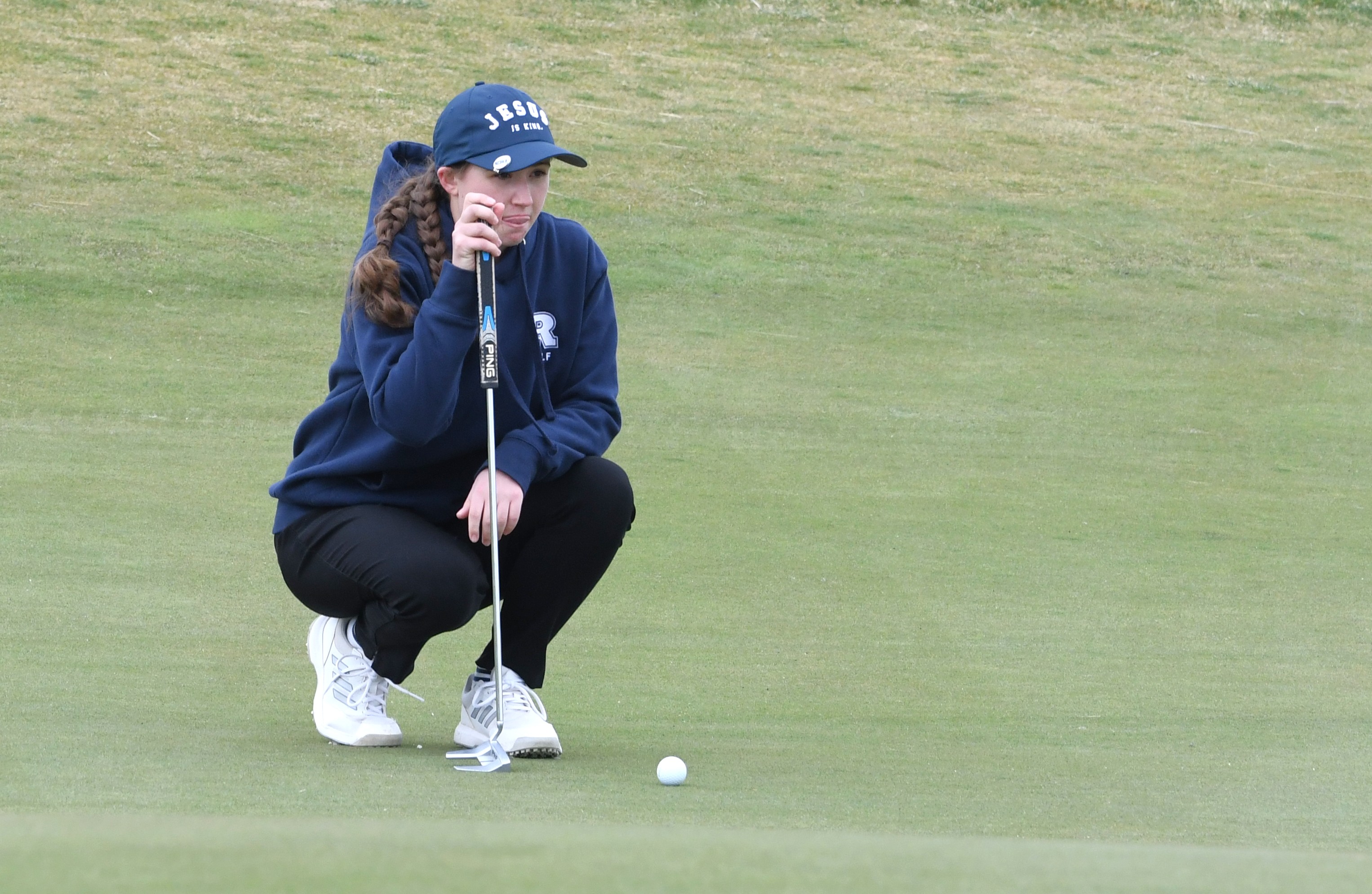 Resurrection Christian's Karina Garcia lines up her putt on the ninth green during the Resurrection Christian Invitational on March 31 at RainDance National in Windsor. (Nathan Wright/Loveland Reporter-Herald)