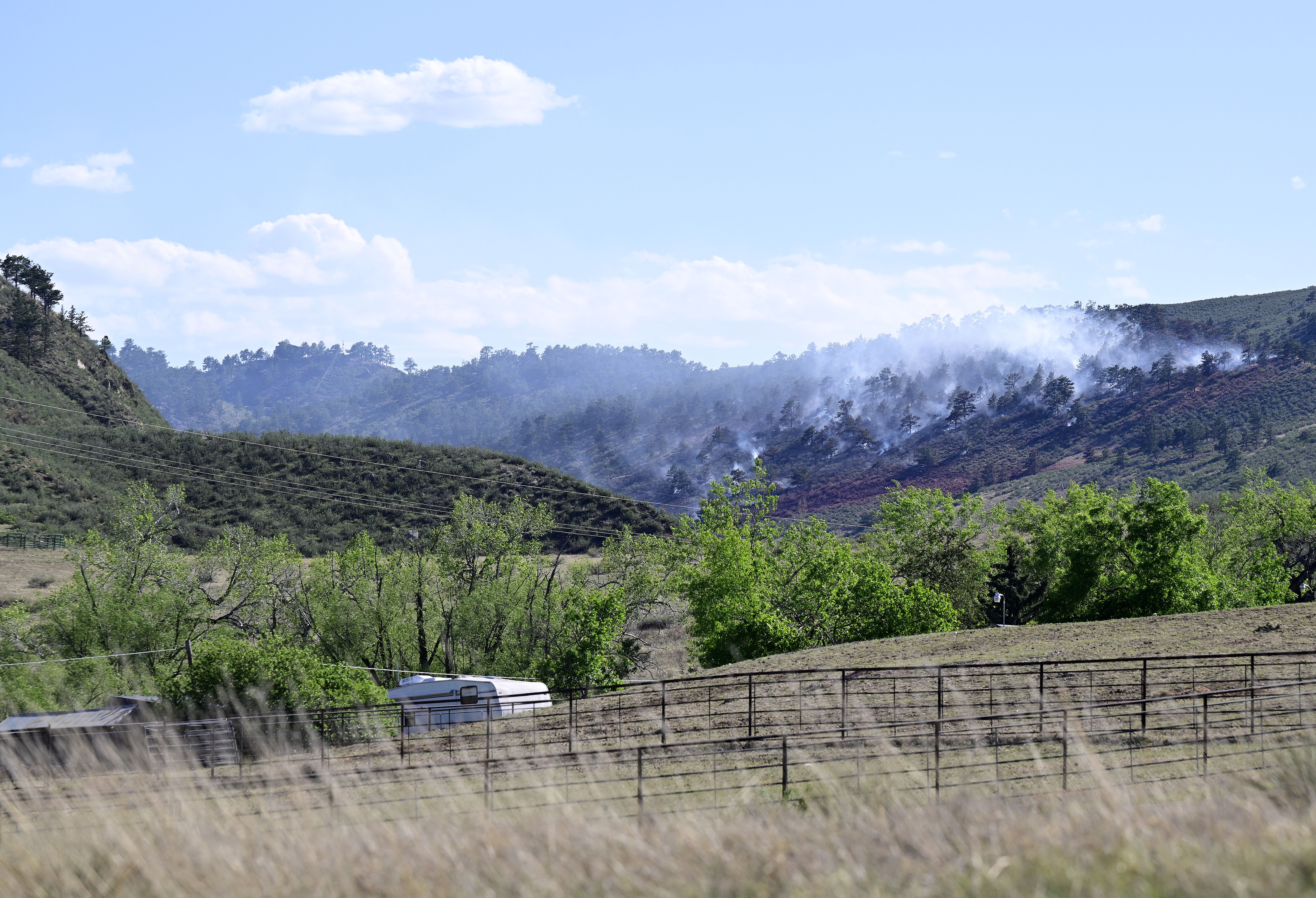 A wildfire burns near Carter Lake Monday, May 11, 2026, west of Loveland.    (Jenny Sparks/Loveland Reporter-Herald)